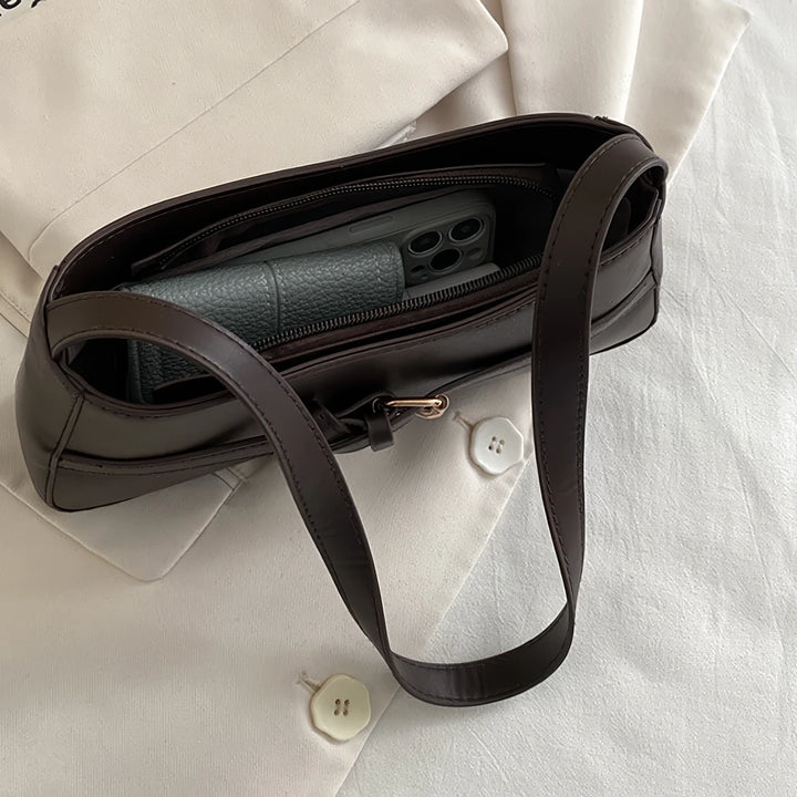 Isla vegan leather shoulder bag with knotted buckle strap