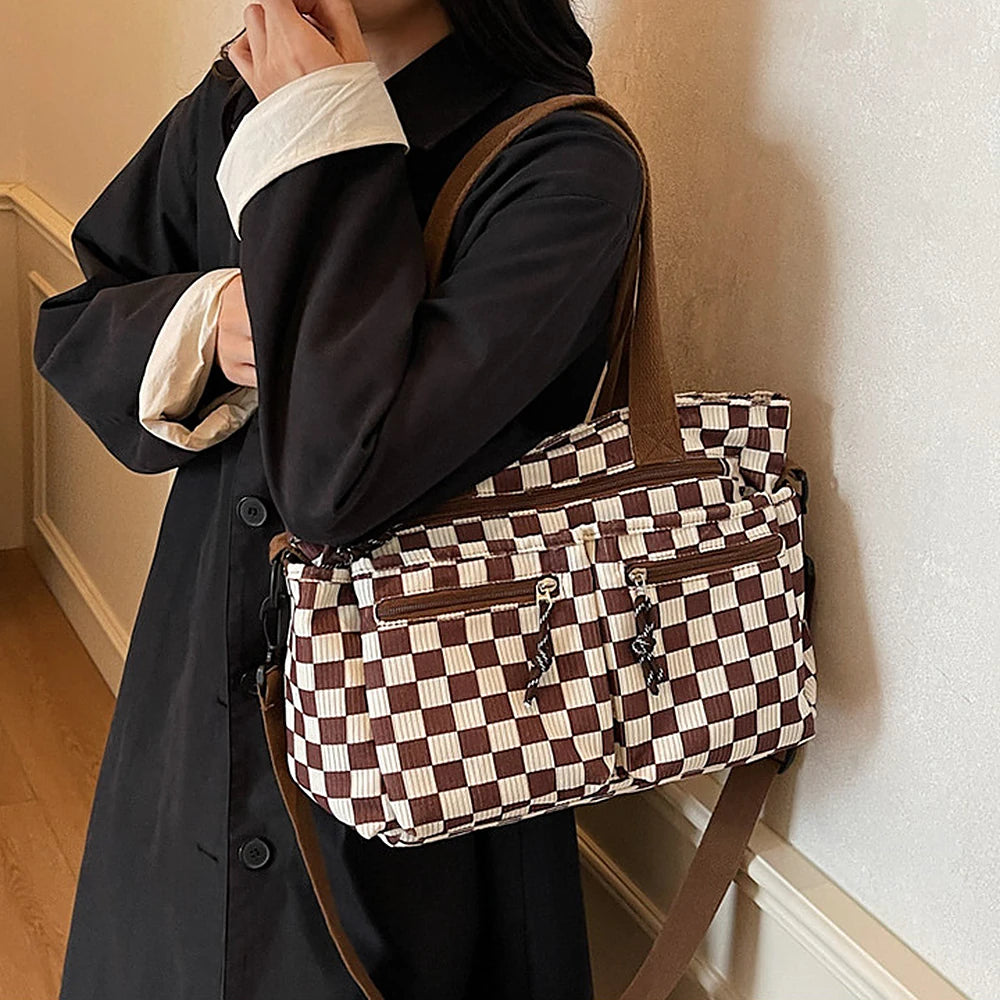 Kanna checkered corduroy shoulder bag with front zip pockets
