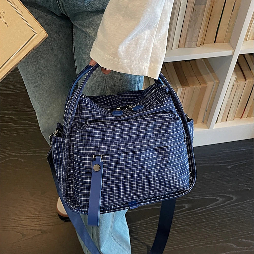 Lyona grid fabric crossbody bag with front zip pocket