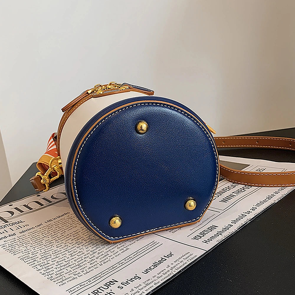 Romy vegan leather crossbody bucket bag with scarf-wrapped handle