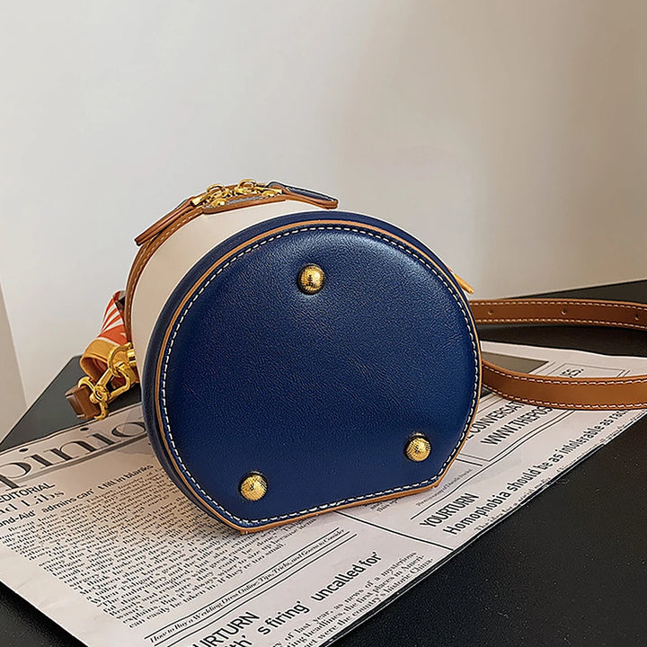 Romy vegan leather crossbody bucket bag with scarf-wrapped handle