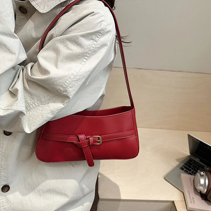 Isla vegan leather shoulder bag with knotted buckle strap