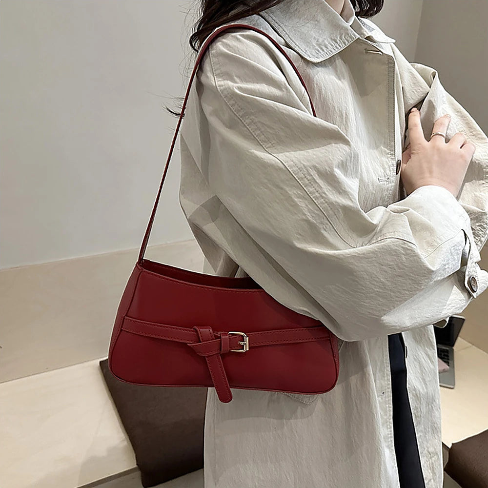 Isla vegan leather shoulder bag with knotted buckle strap