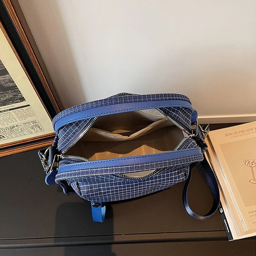 Lyona grid fabric crossbody bag with front zip pocket