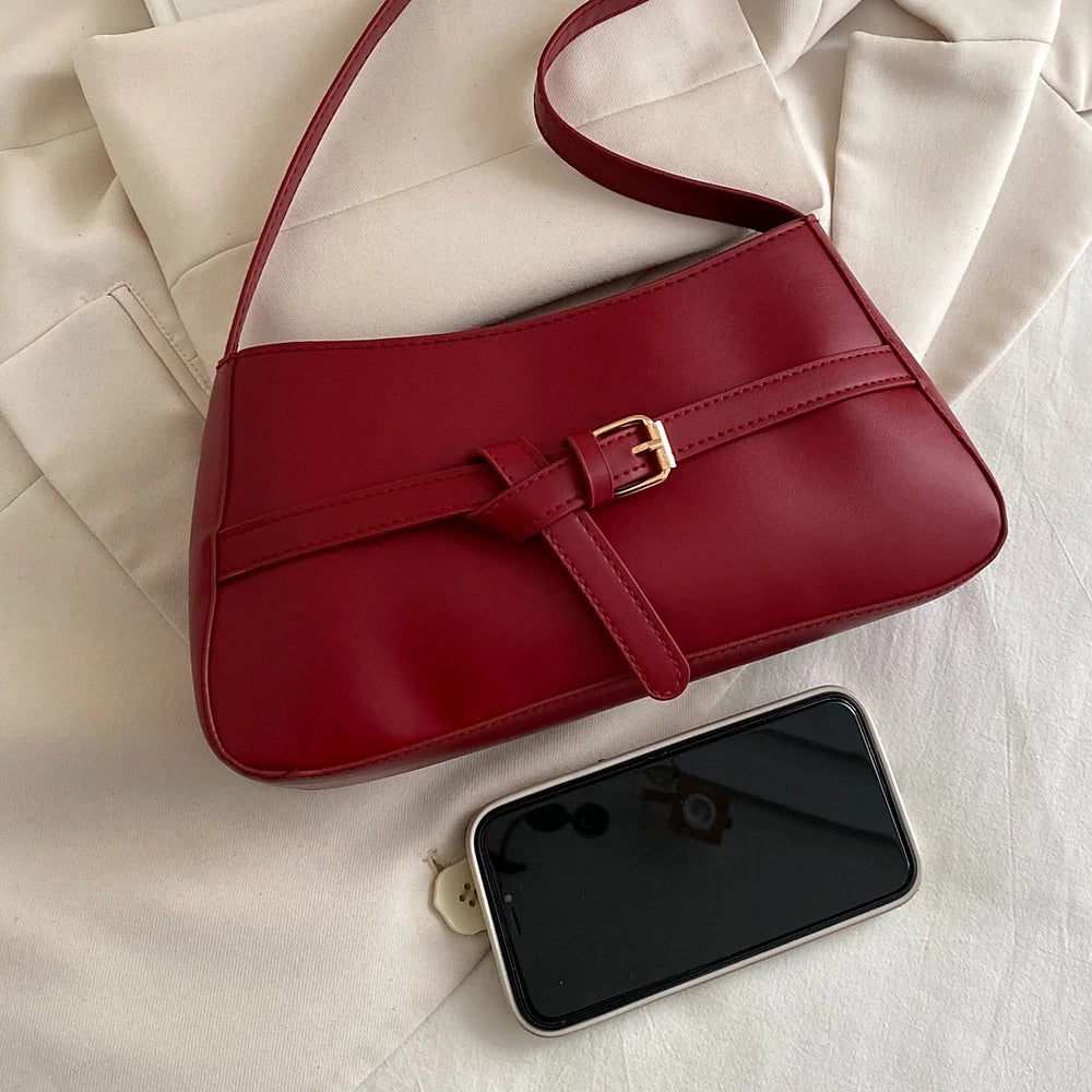Isla vegan leather shoulder bag with knotted buckle strap