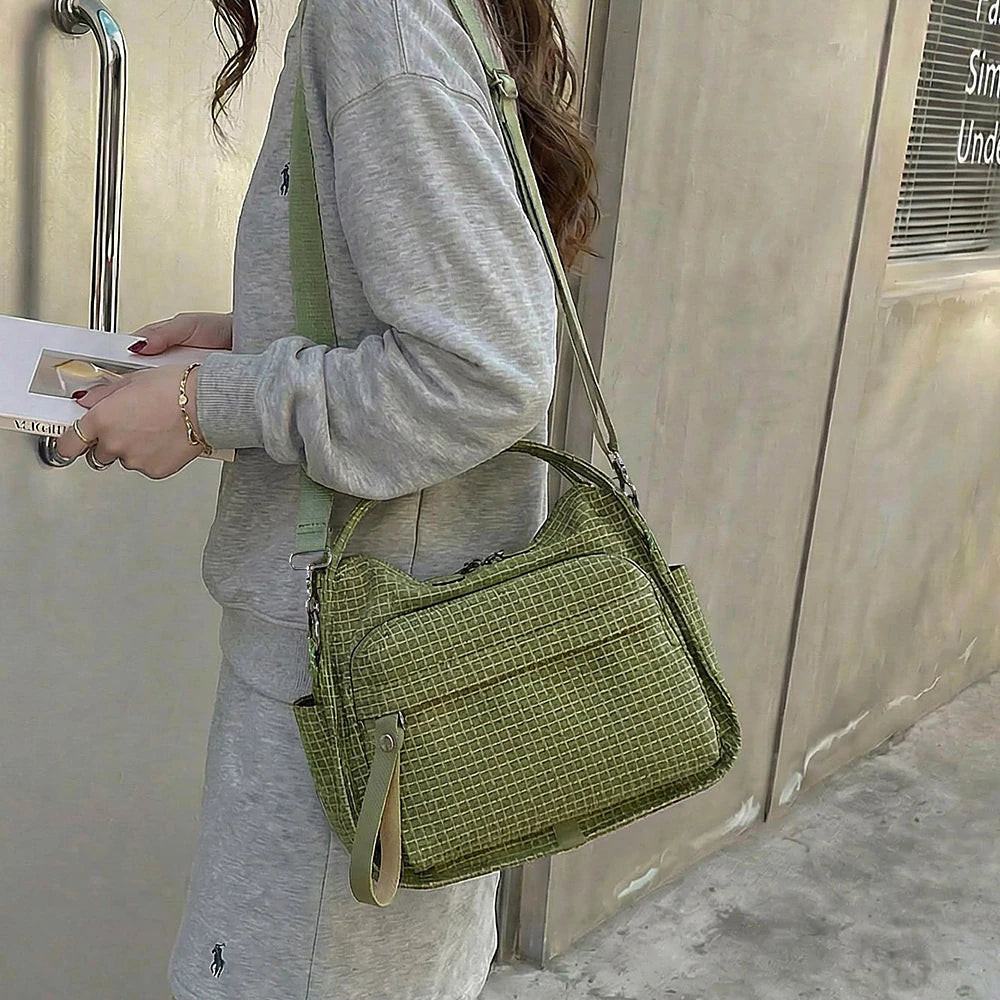 Lyona grid fabric crossbody bag with front zip pocket