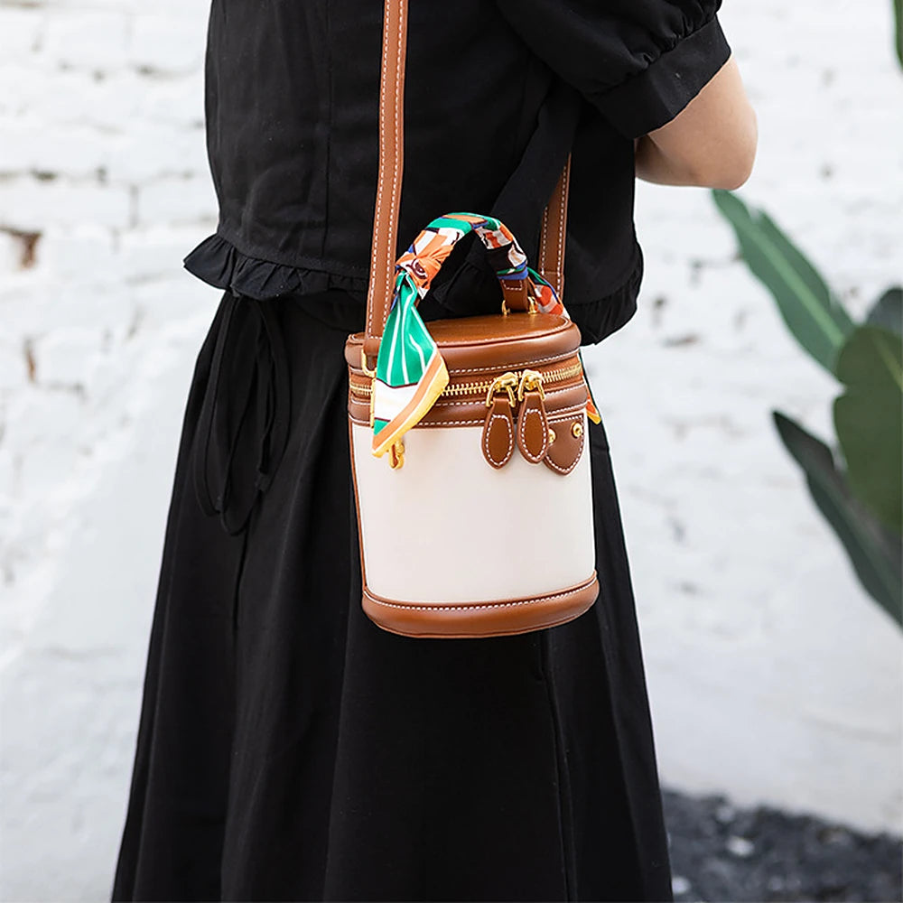 Romy vegan leather crossbody bucket bag with scarf-wrapped handle