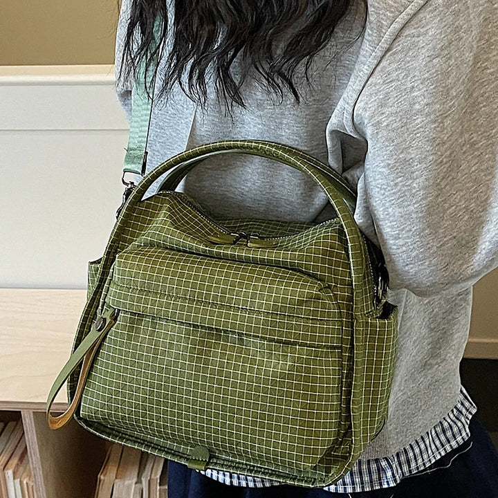 Lyona grid fabric crossbody bag with front zip pocket