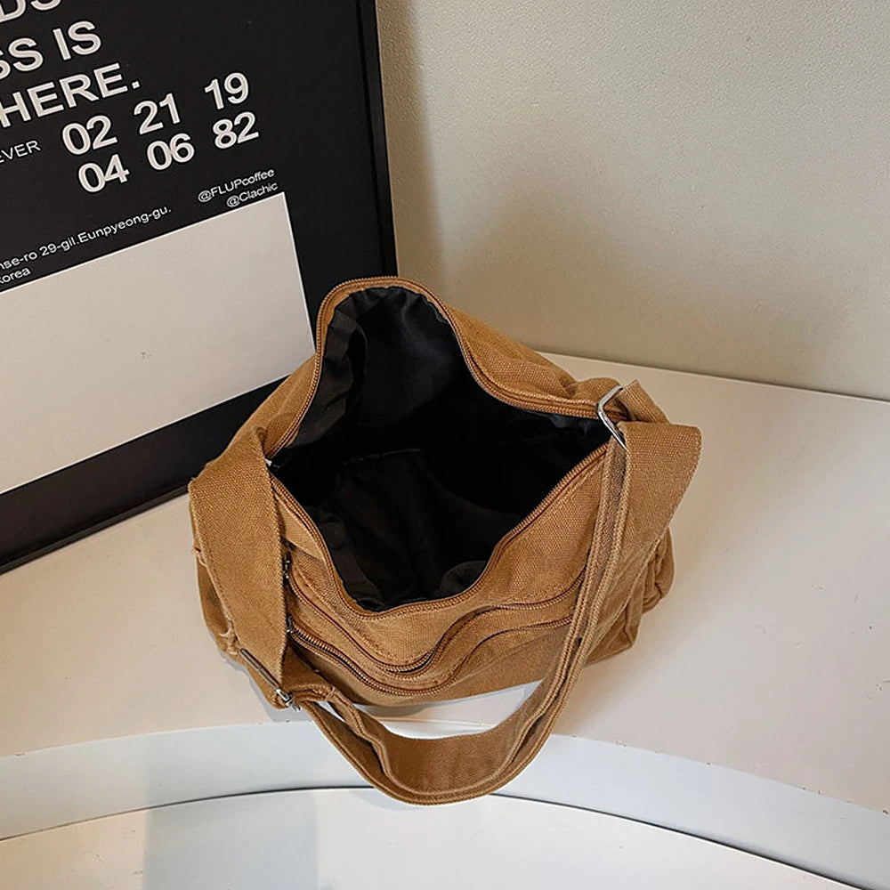 Rina washed canvas crossbody bag with front zip pockets