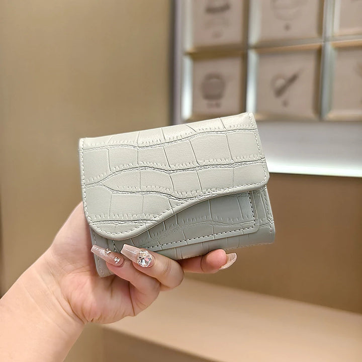 Alba croc-embossed vegan leather trifold wallet with curved flap