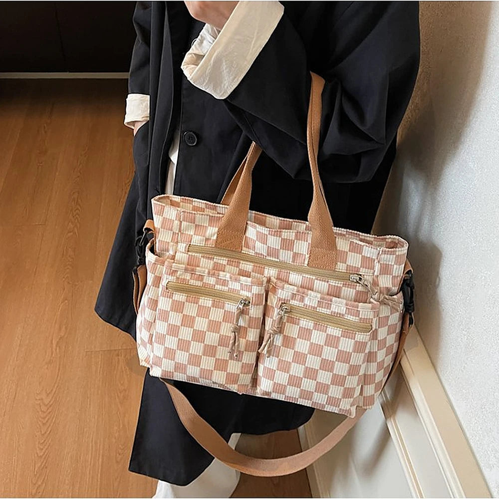 Kanna checkered corduroy shoulder bag with front zip pockets