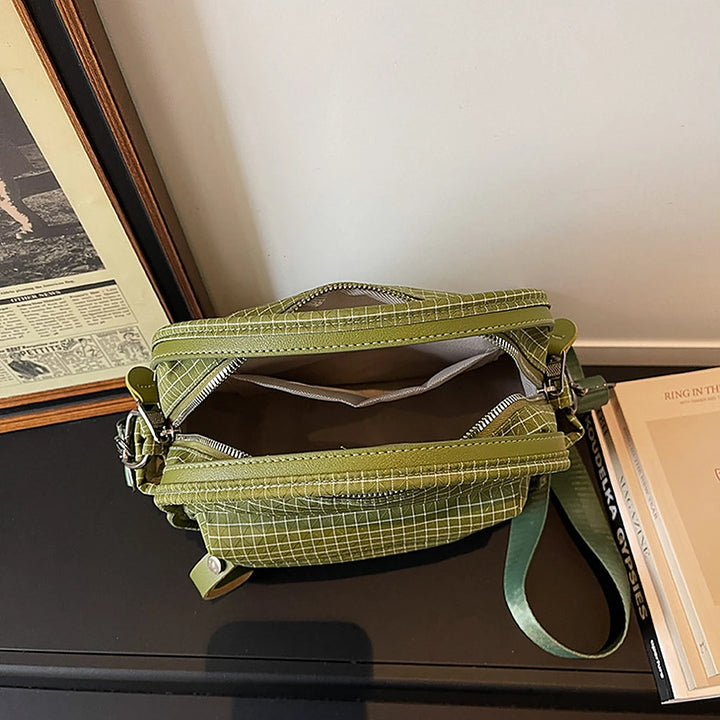 Lyona grid fabric crossbody bag with front zip pocket