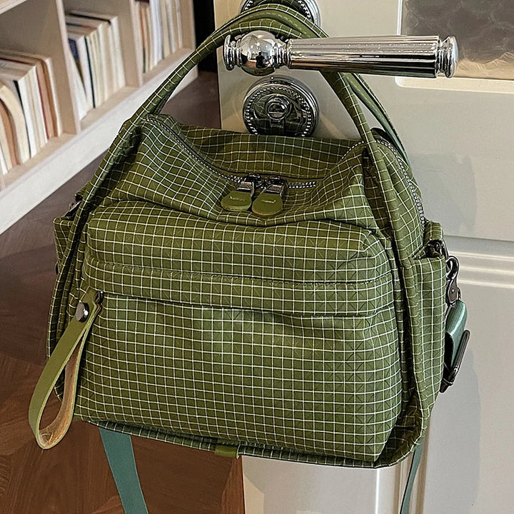 Lyona grid fabric crossbody bag with front zip pocket