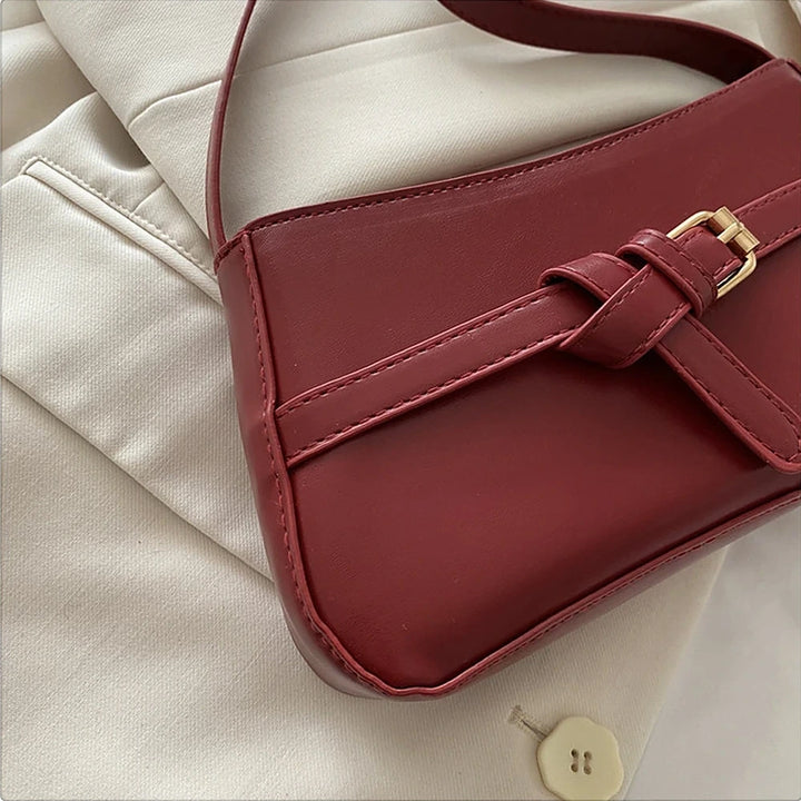 Isla vegan leather shoulder bag with knotted buckle strap