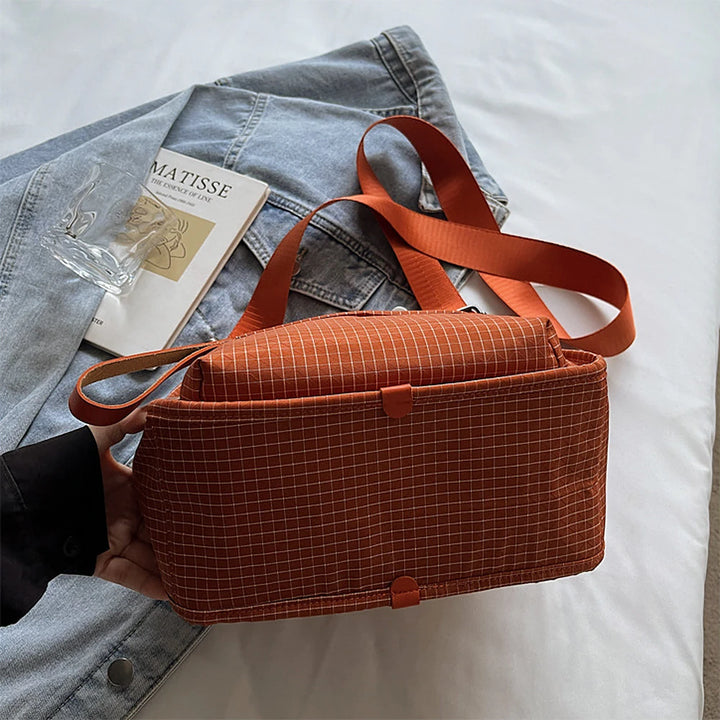 Lyona grid fabric crossbody bag with front zip pocket