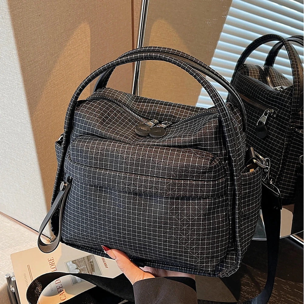 Lyona grid fabric crossbody bag with front zip pocket