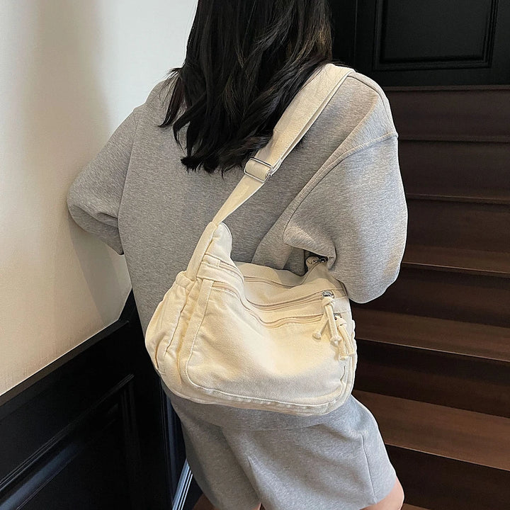 Rina washed canvas crossbody bag with front zip pockets