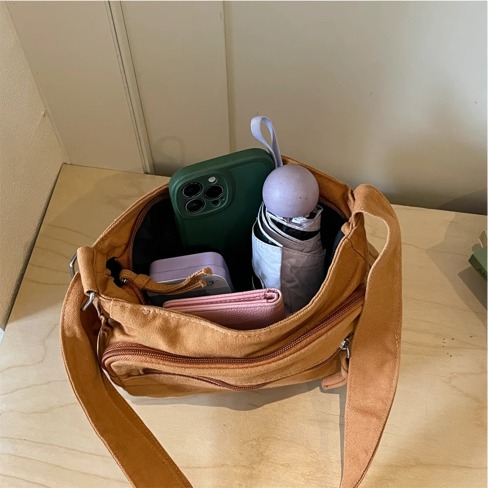 Rina washed canvas crossbody bag with front zip pockets