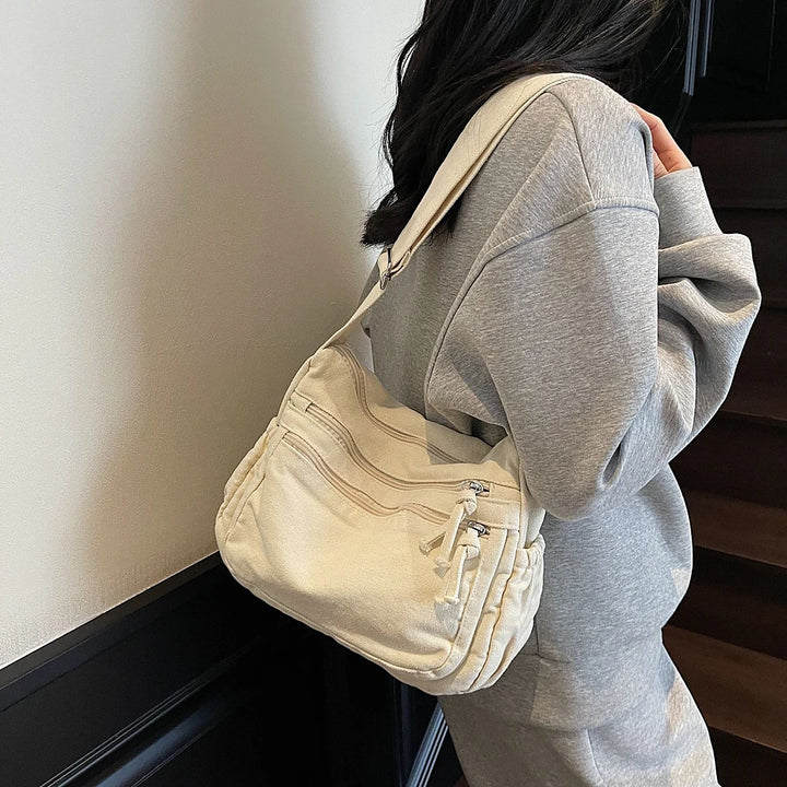 Rina washed canvas crossbody bag with front zip pockets