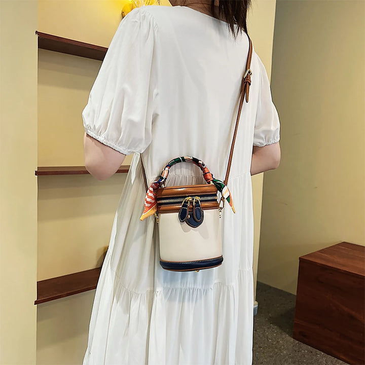 Romy vegan leather crossbody bucket bag with scarf-wrapped handle