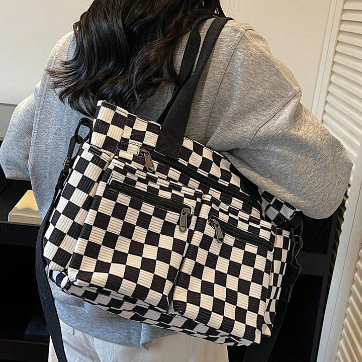 Kanna checkered corduroy shoulder bag with front zip pockets