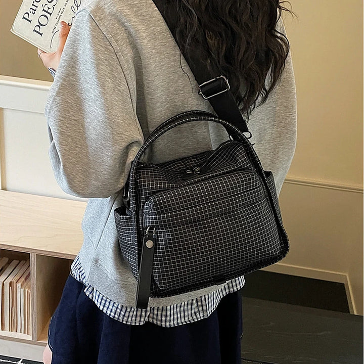 Lyona grid fabric crossbody bag with front zip pocket