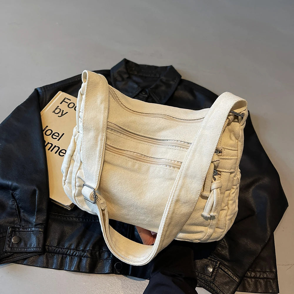 Rina washed canvas crossbody bag with front zip pockets