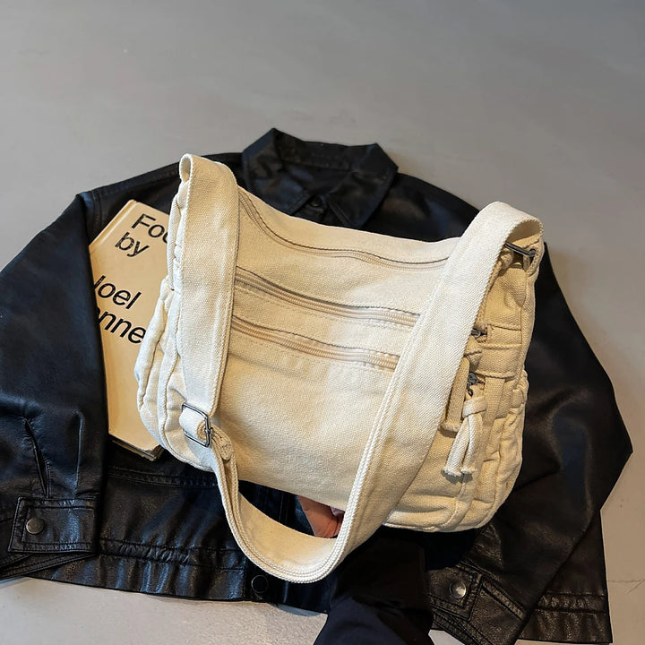 Rina washed canvas crossbody bag with front zip pockets