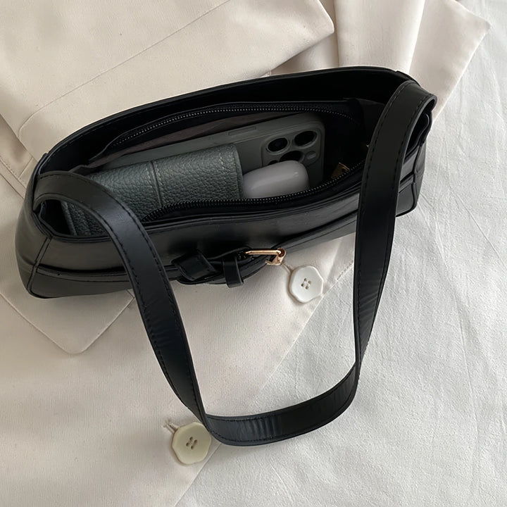 Isla vegan leather shoulder bag with knotted buckle strap