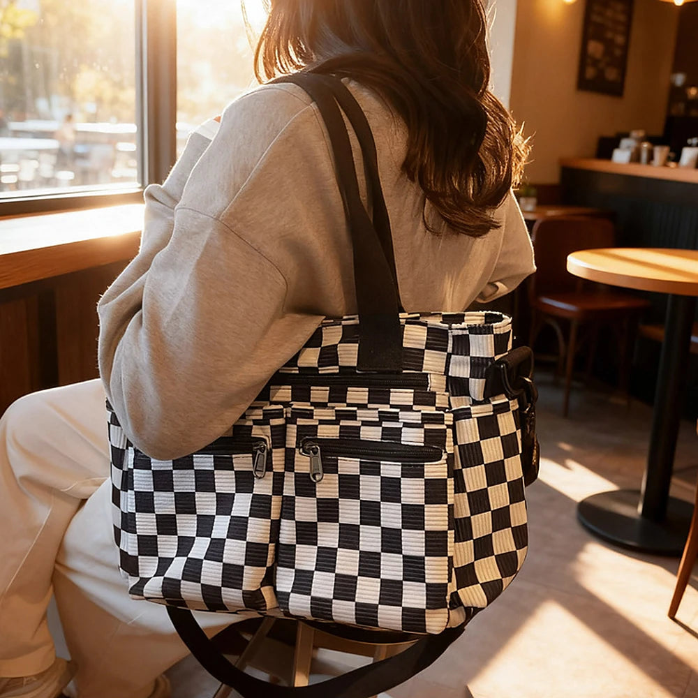 Kanna checkered corduroy shoulder bag with front zip pockets