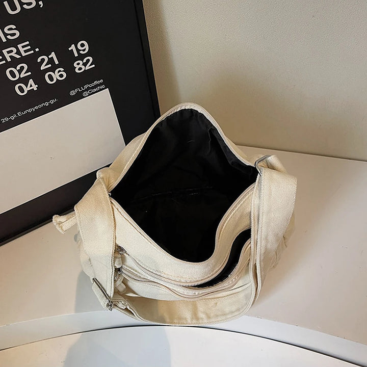 Rina washed canvas crossbody bag with front zip pockets