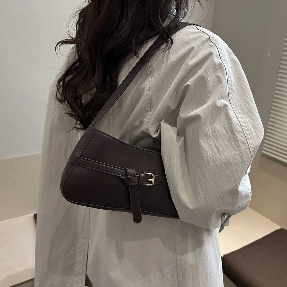 Isla vegan leather shoulder bag with knotted buckle strap