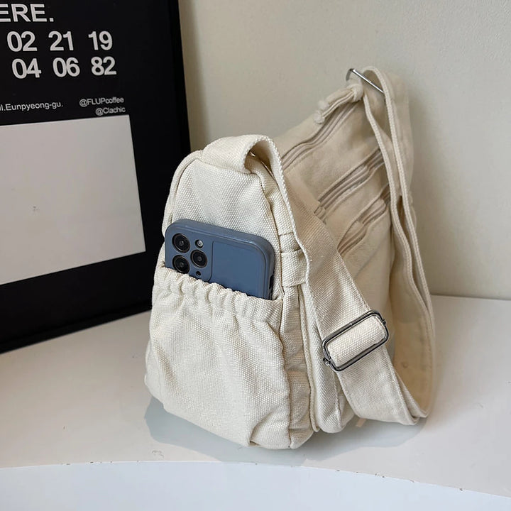 Rina washed canvas crossbody bag with front zip pockets