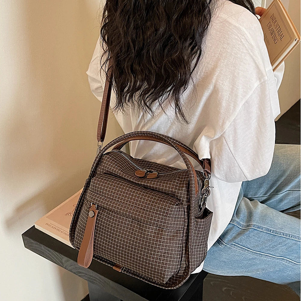 Lyona grid fabric crossbody bag with front zip pocket