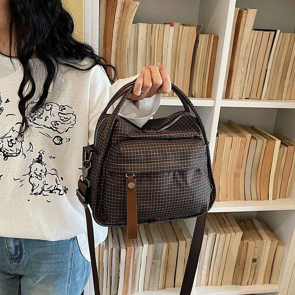 Lyona grid fabric crossbody bag with front zip pocket