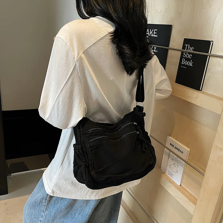 Rina washed canvas crossbody bag with front zip pockets