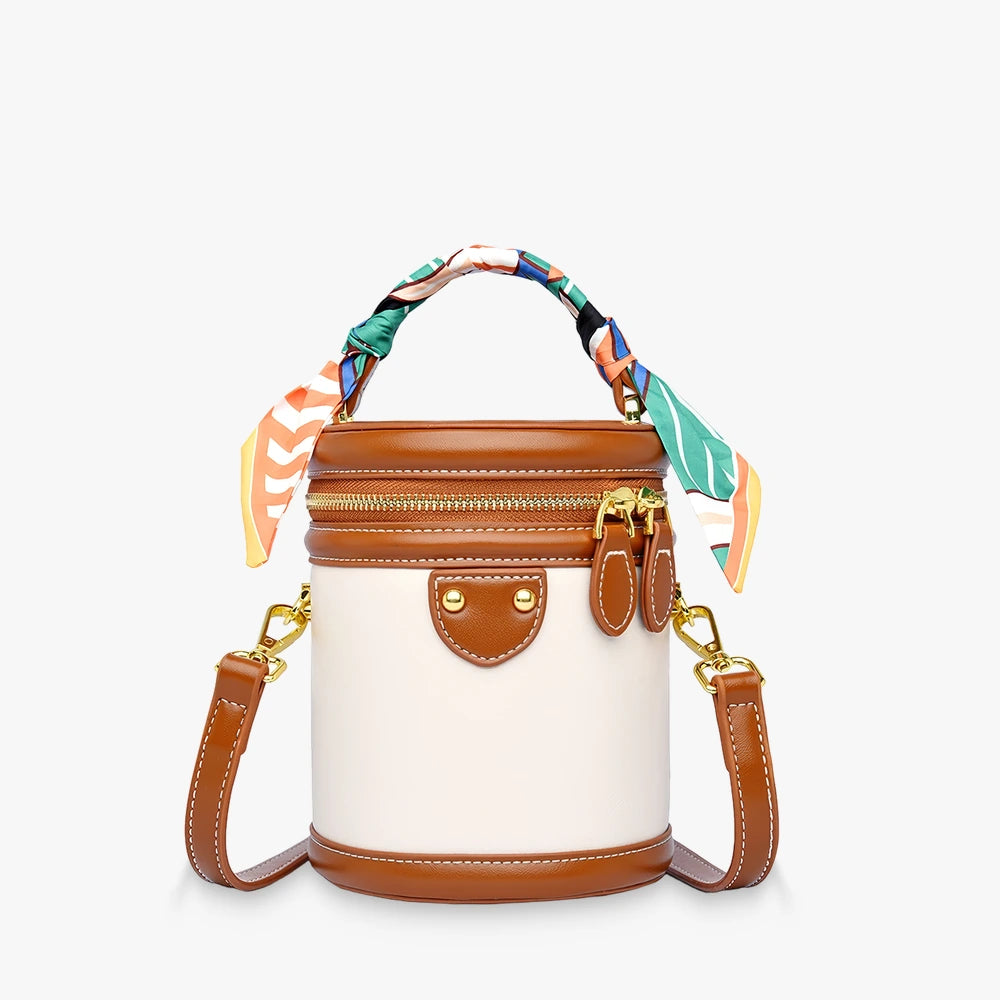 Romy vegan leather crossbody bucket bag with scarf-wrapped handle in Beige / Brown