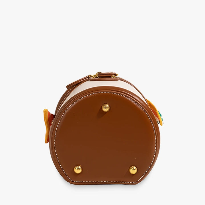 Romy vegan leather crossbody bucket bag with scarf-wrapped handle in Beige / Brown